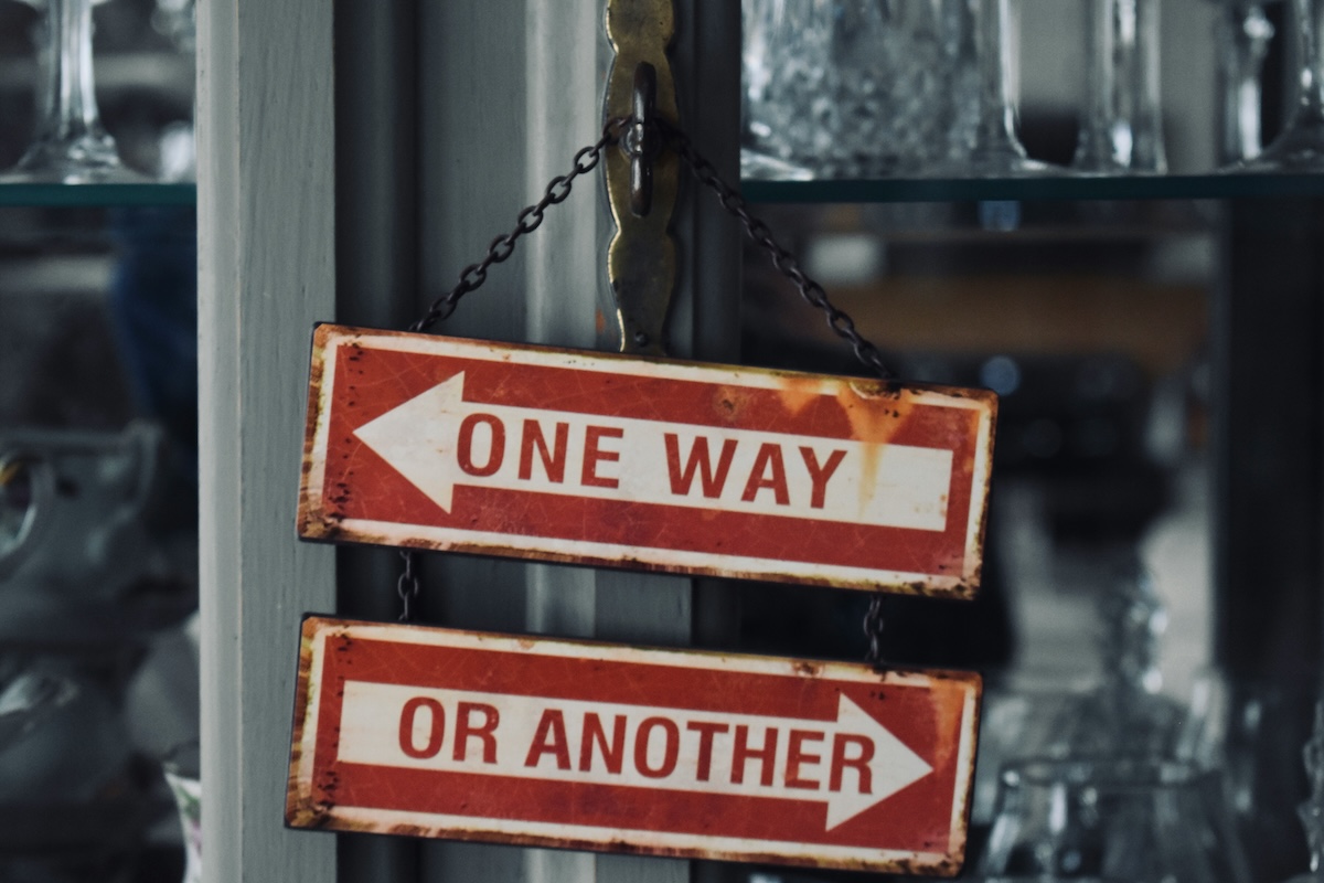 Two directional signs pointing different ways