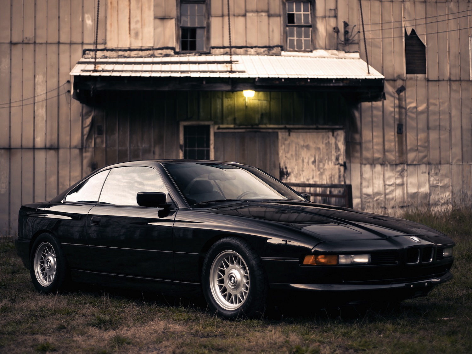 BMW 850i E31 in profile, long bonnet, low roofline, a grand tourer that looks as purposeful parked as it does moving