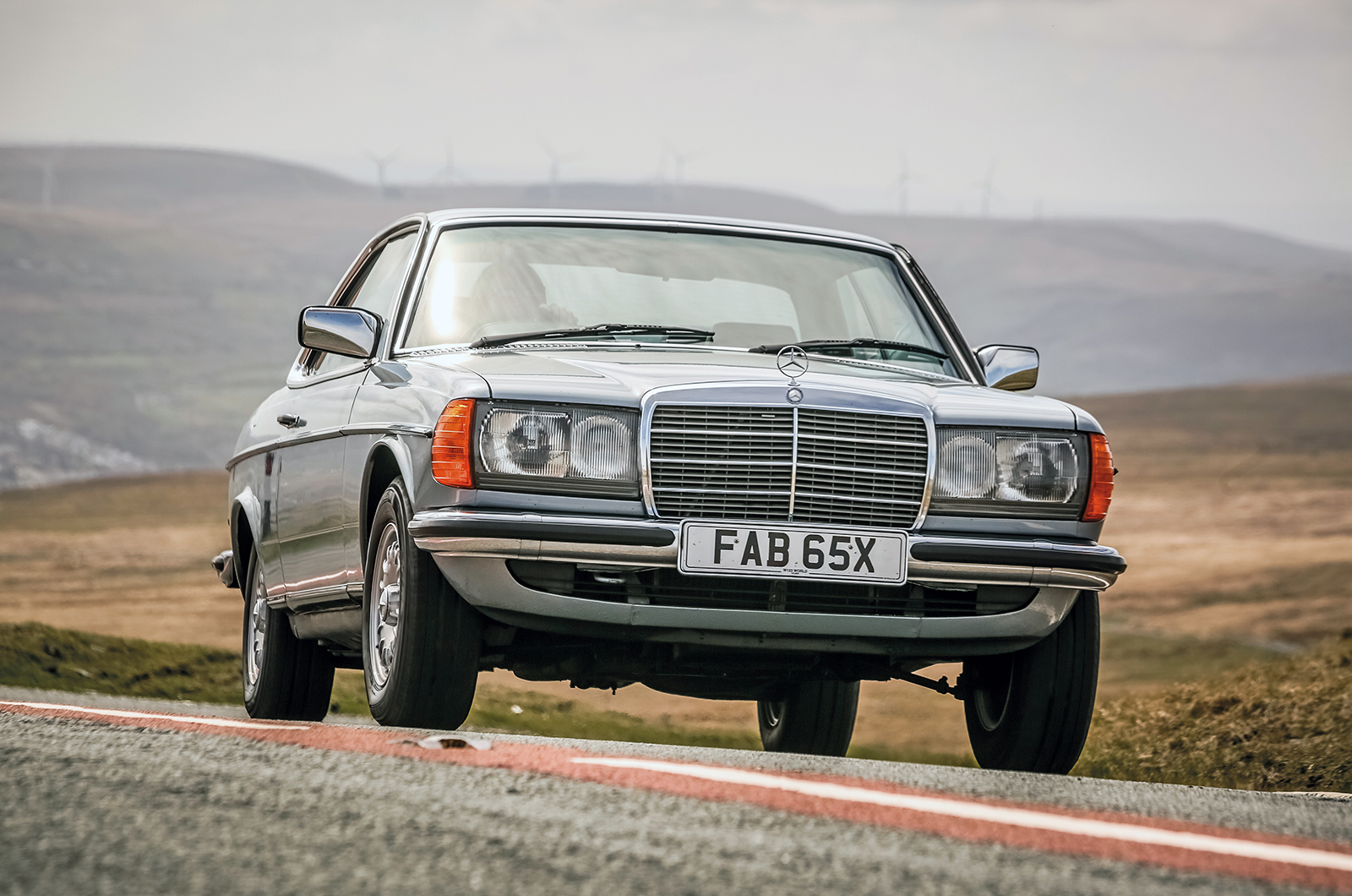 Mercedes-Benz W123 sedan in three-quarter view, upright, formal, built to outlast almost everything around it